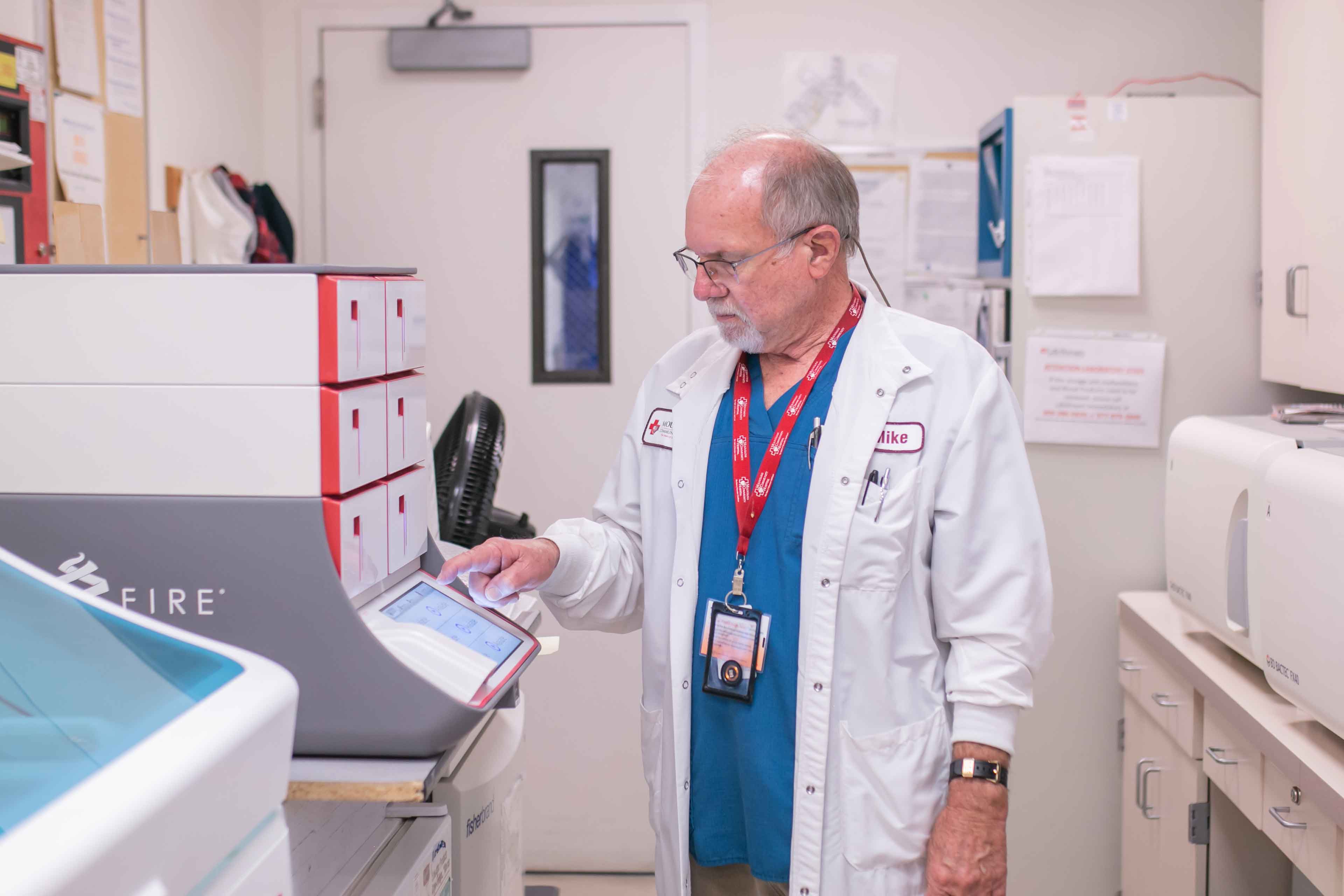 Mountains community health doctor using a machine
